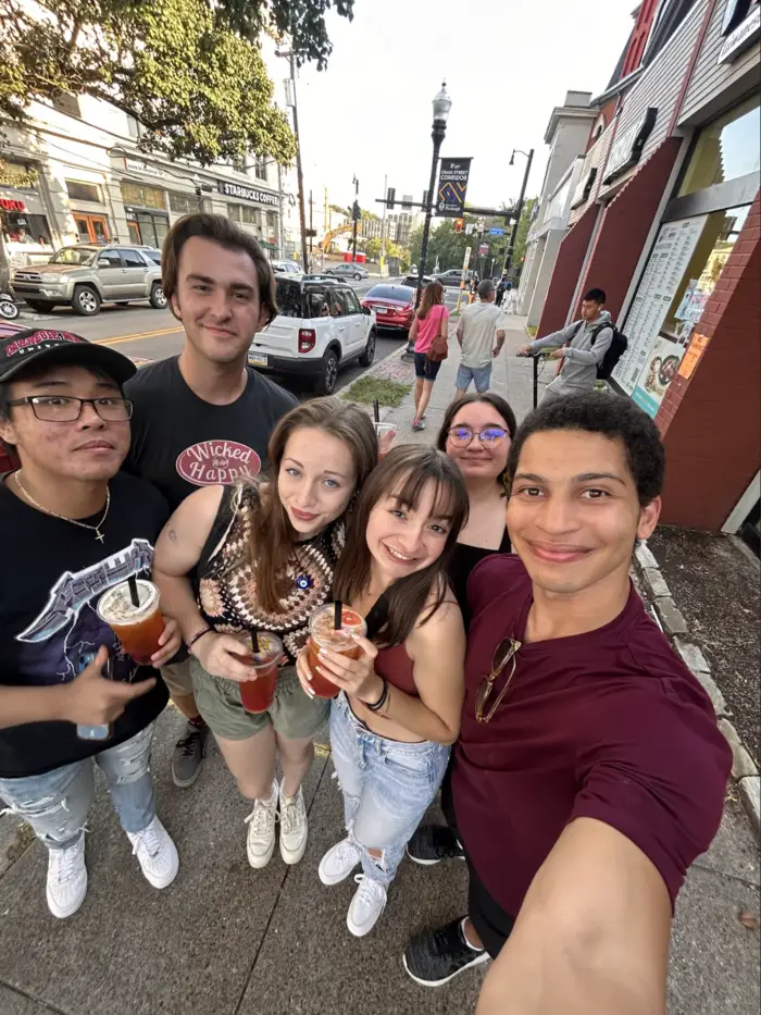 students hanging outside coffee shop