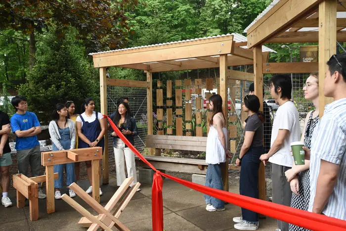 Esha and other architecture students discuss a project