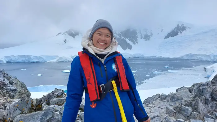 Wen poses for a photo in Antarctica