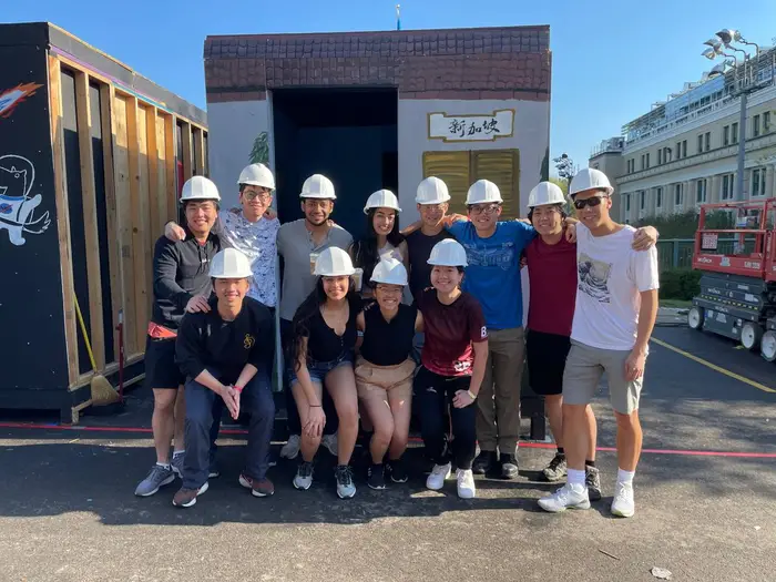 Wen poses with her fellow booth participants in front of their project