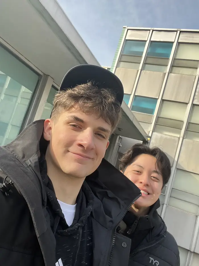 An Image of Ryan walking around campus with a friend