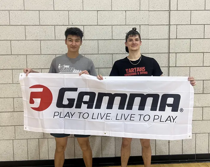Ryan poses with a friend after winning a campus pickleball tournament