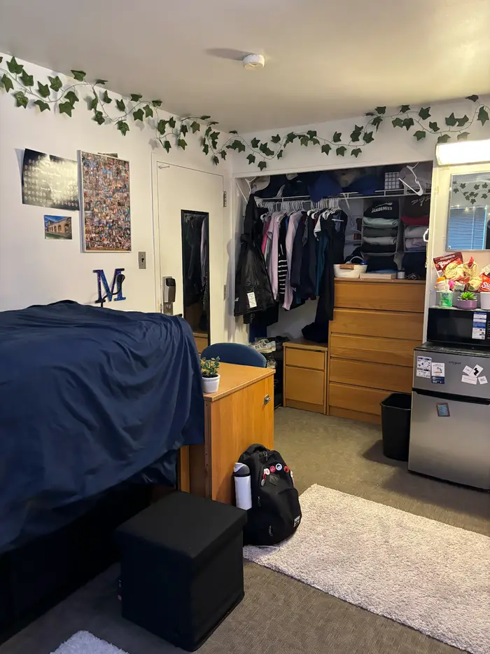A photo of Miriam's dorm showing her closets and drawers.
