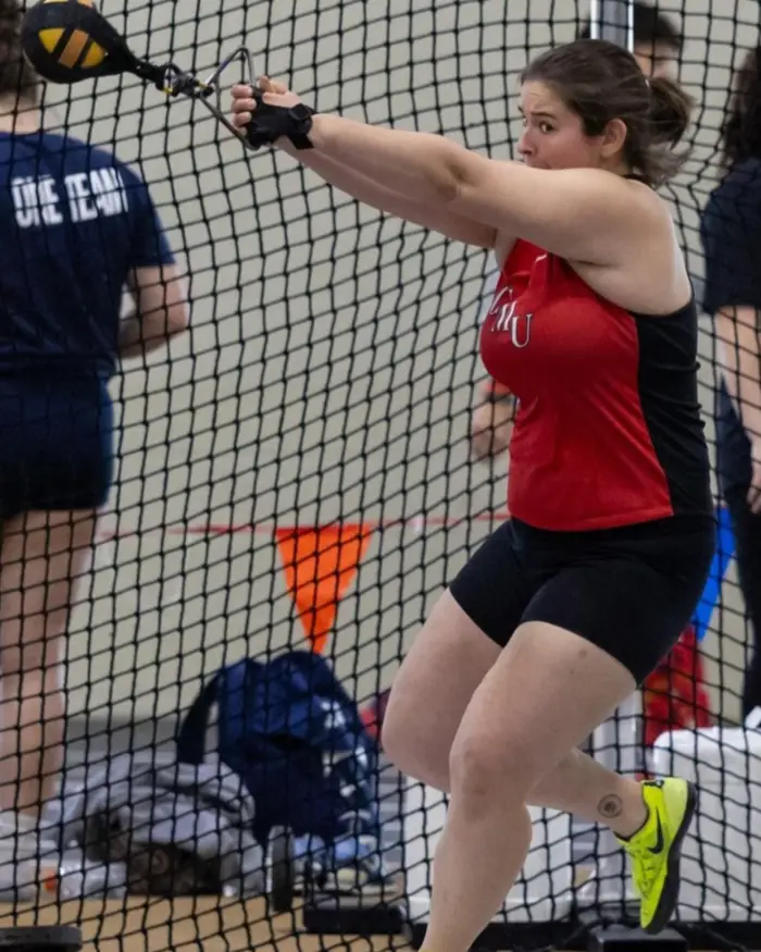 Katie throws during a track meet