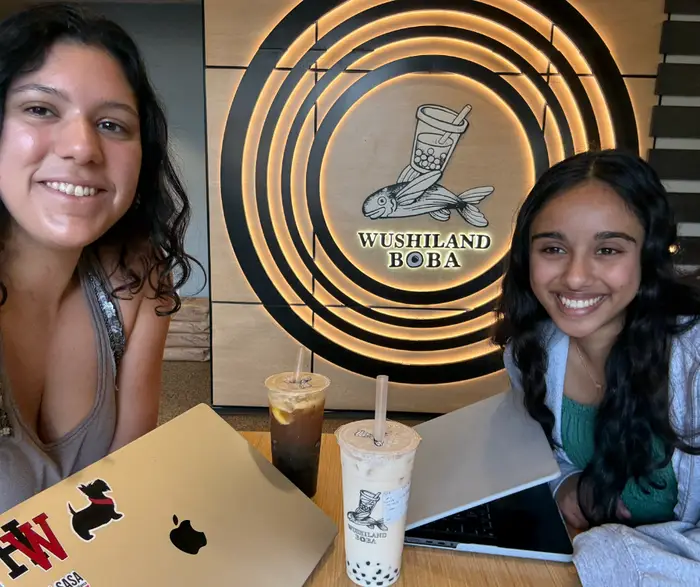 Riyan and Riya pose for a photo at a Boba shop