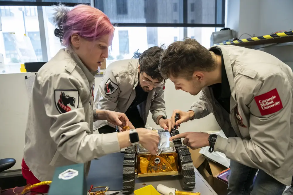 Students working together on a rover