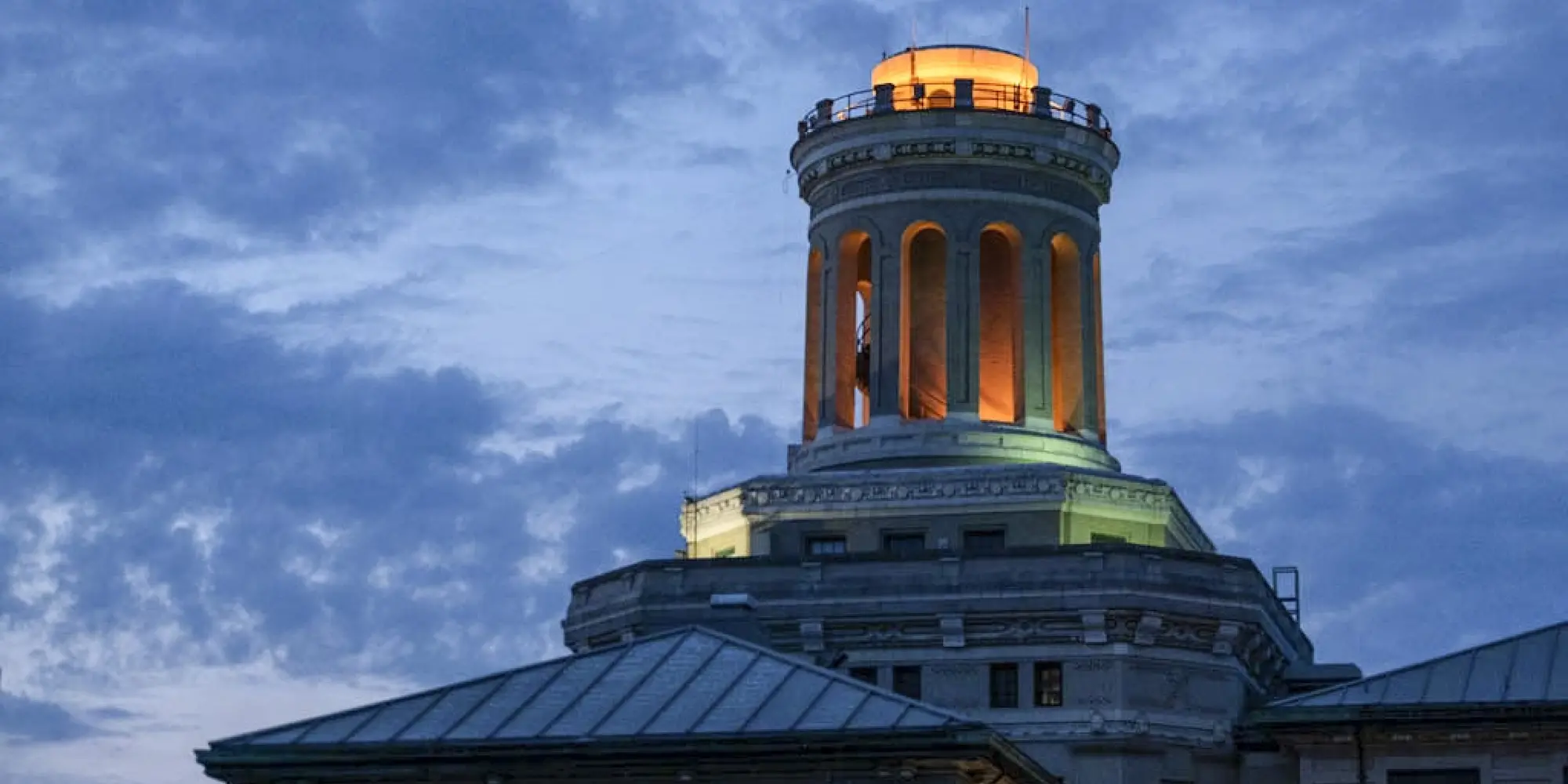 Outdoor nighttime CMU campus photo with blue sky