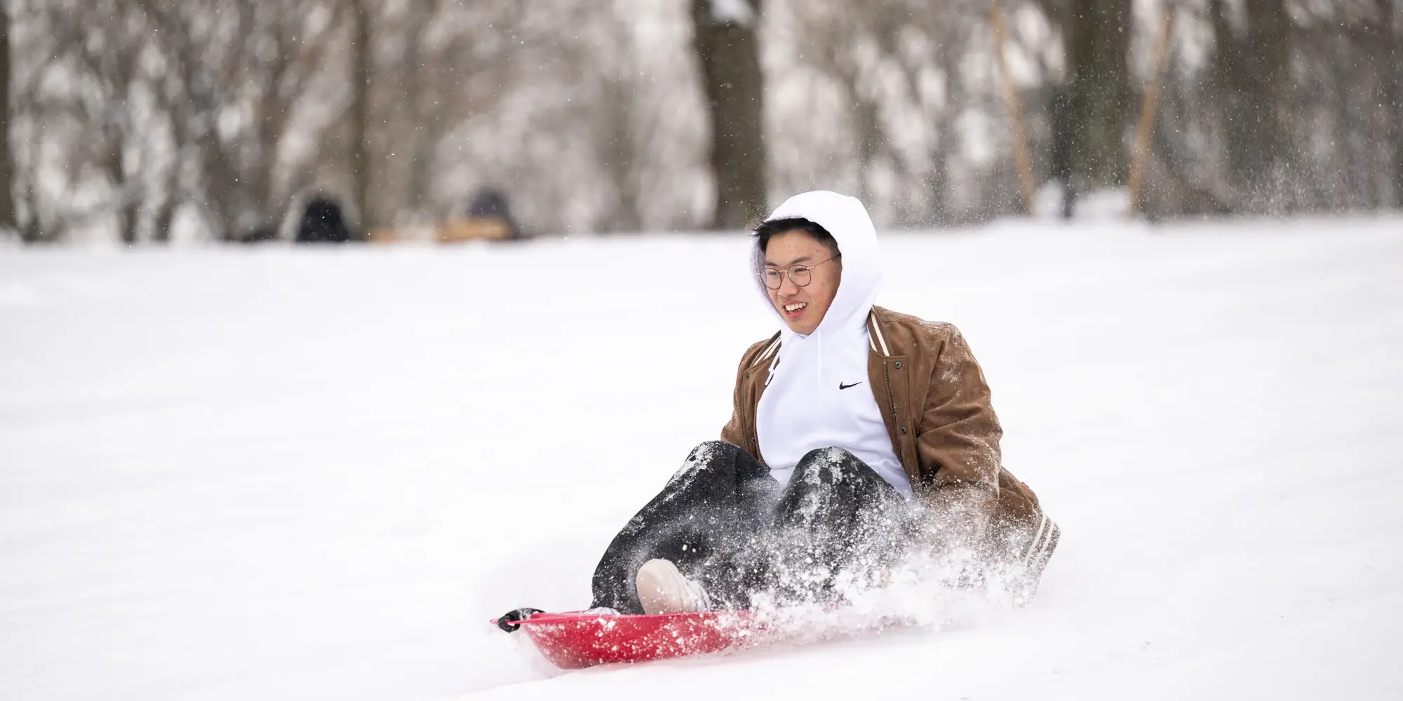 Person sledding on Flagstaff Hill