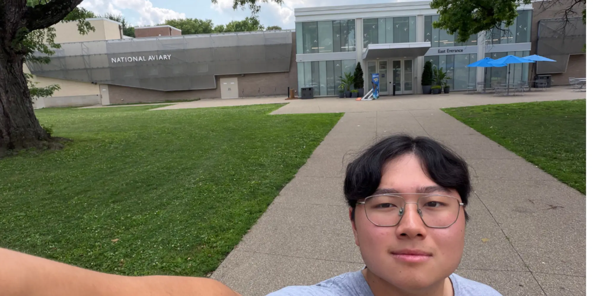 Chris takes a selfie in front of the National Aviary