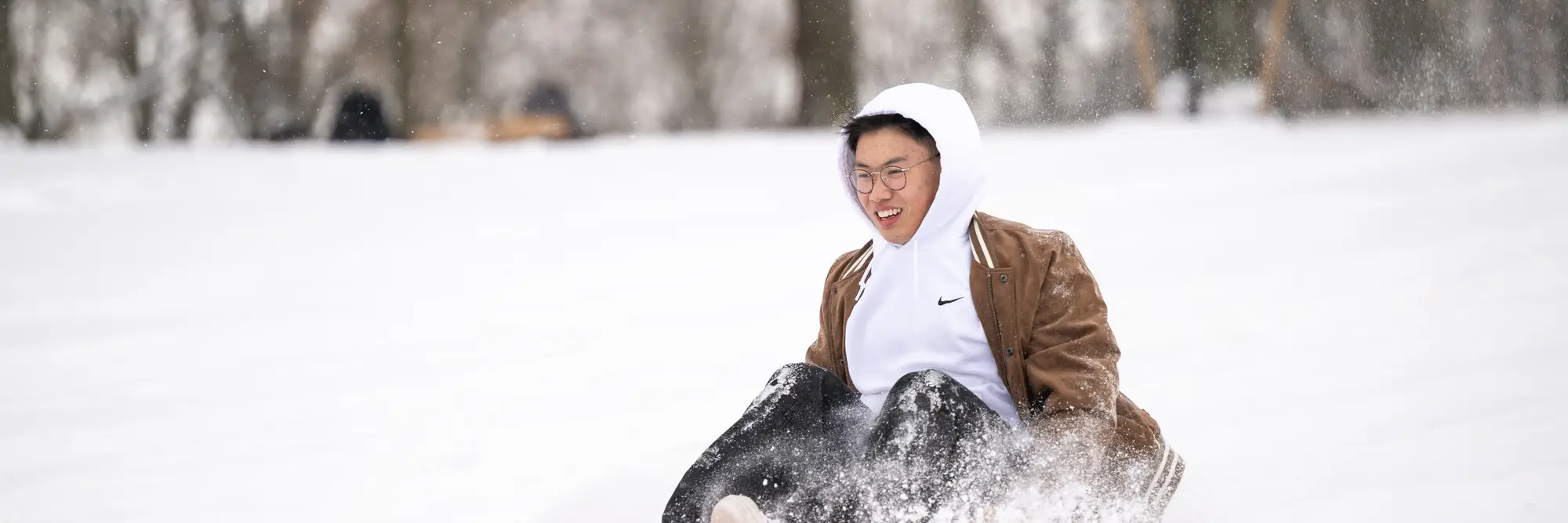 Person sledding on Flagstaff Hill