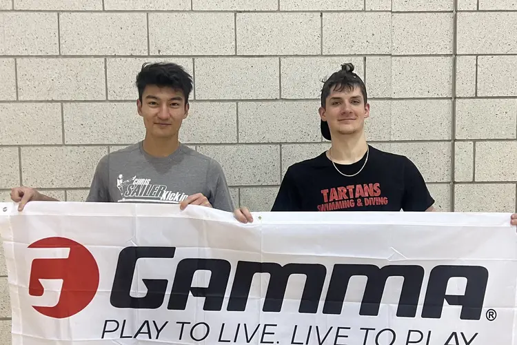 Ryan poses with a friend after winning a campus pickleball tournament